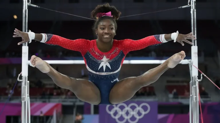 Simone Biles wins the Olympic gymnastics qualifying despite capturing her leg